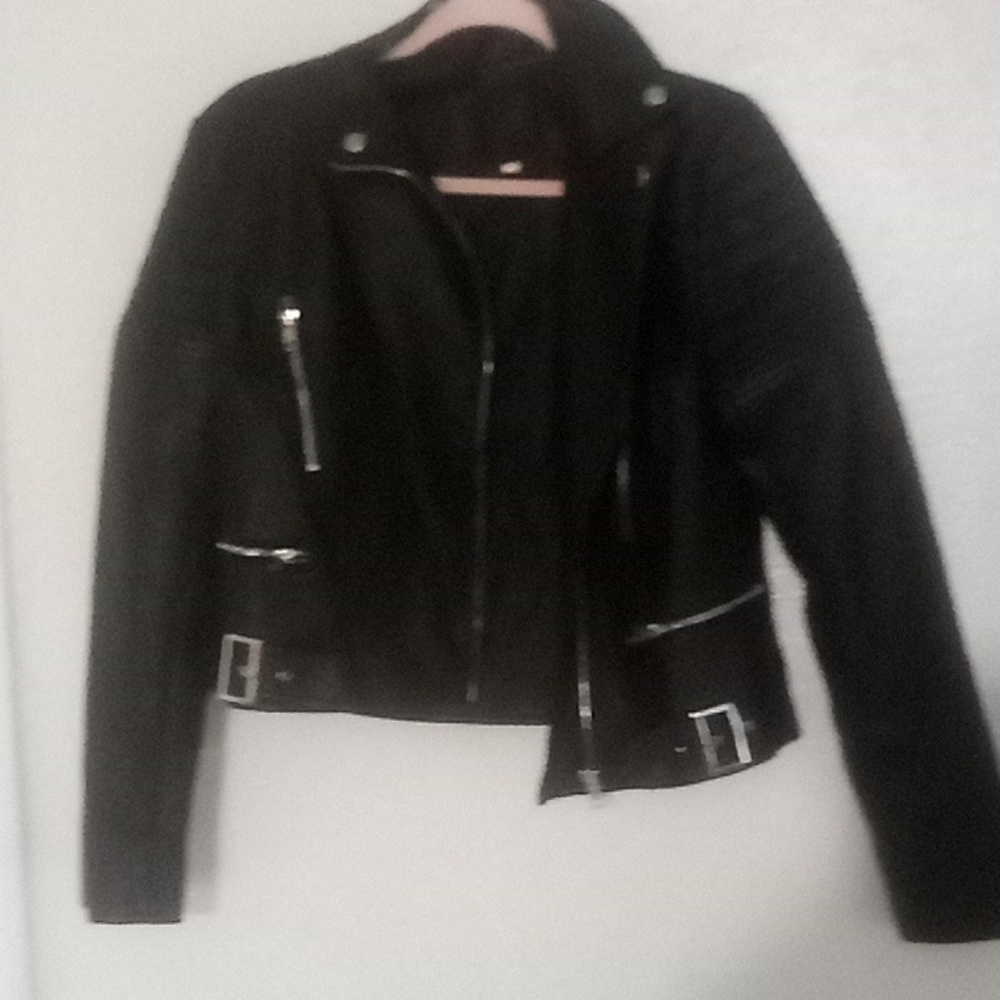 Size medium black jacket with zippers fake leather
